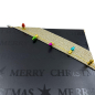 Preview: Geschenkband, Faux light Kordel in gold mit farbigen kleinen Tannenbaumlichter, Detail an einer Geschenkverpackung